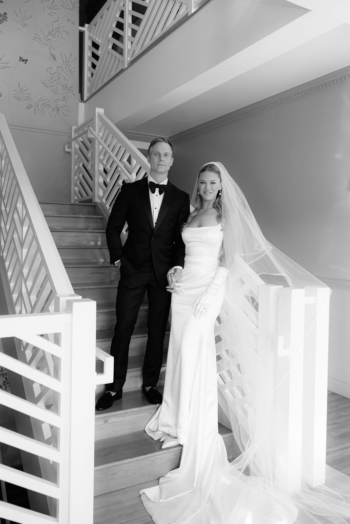 Black and white bride and groom staircase portrait